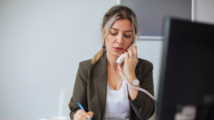 office manager talks on the phone