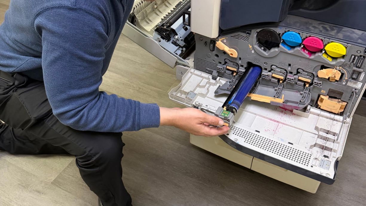 Technician Dave works on refurbishing a printer in Phoenix, Arizona