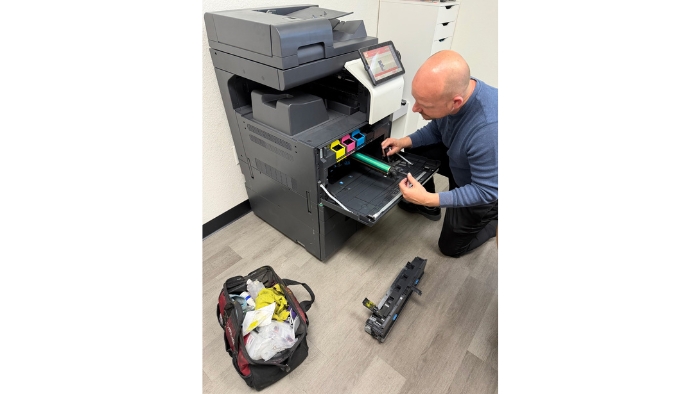 Technician Dave works on refurbishing a copier to put back into service